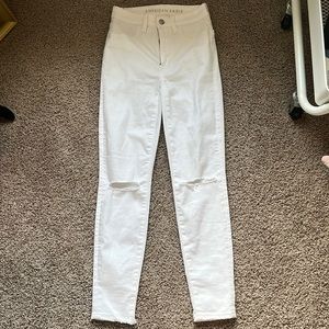 All white American eagle jeans, ripped on the knees, only worn once